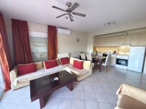 Deluxe Apartment, 2 Bedrooms | Living area | Flat-screen TV - Olive Tree Apartment (Parga)