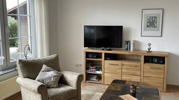 Televisio, takka, kirjoja