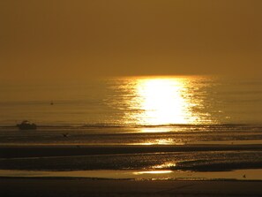 On the beach, sun-loungers