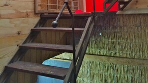 A wooden staircase with a metal railing leading to a red door. - A Cocoon for 2 People With a Beautiful View of the Valley Tournai (Beclers)