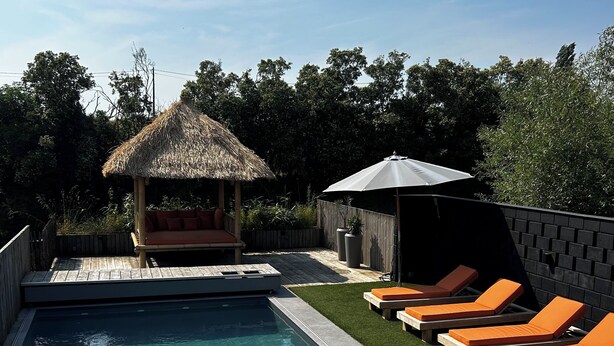 A swimming pool with lounge chairs and a small gazebo. - A Cocoon for 2 People With a Beautiful View of the Valley Tournai (Beclers)