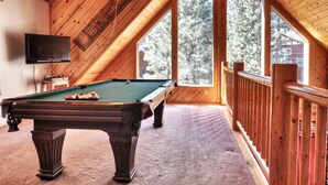 A pool table in a room with wooden walls and large windows. - Pine Lodge at Snow Summit.  Spa and Pool Table! (Big Bear)