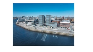 A waterfront cityscape with modern buildings, a marina, and a bridge. - Holiday Inn Hamburg - Hafencity by IHG (Hamburg)