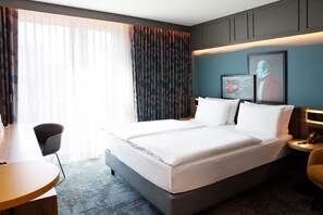 Hypo-allergenic bedding, desk, laptop workspace, blackout curtains