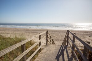 A wooden boardwalk leading to a beach with a clear view of the ocean. - Pajaro Dunes House 81 (Watsonville)