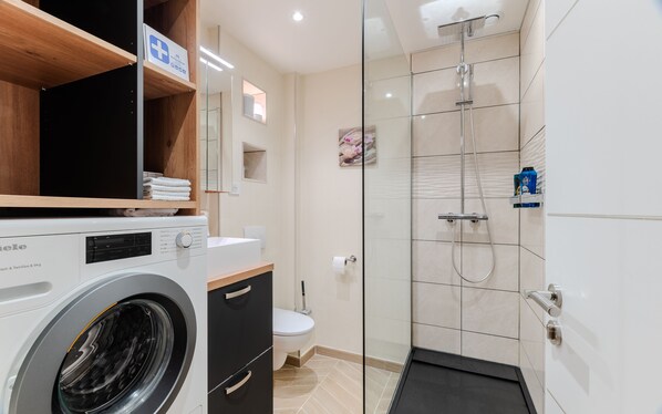 Shower, hair dryer, towels, soap