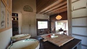 A rustic kitchen with wooden beams, a large wooden table, and two large ceramic bowls. - LUXURY VILLA 4 BEDROOMS NEAR TO TORRE GUACETO BEACHES, CAROVIGNO,  OSTUNI (Serranova)