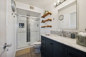 Bathtub, hair dryer, towels, soap