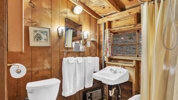 Shower, hair dryer, towels, toilet paper