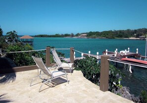 Terrace/patio - Luxury Waterfront Condo w/ Pool, Dock, and Gardens (West End)