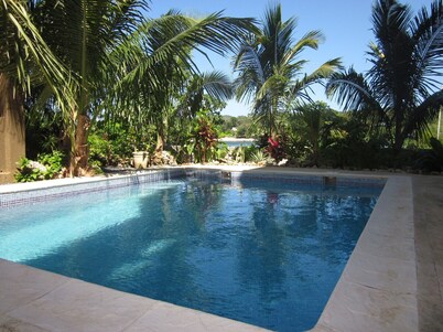 Luxury Waterfront Condo w/ Pool,  Dock, and Gardens 