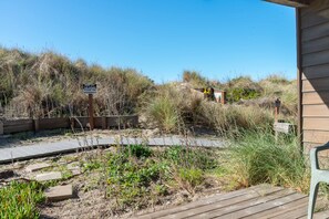 Explore the natural surroundings from the boardwalk, offering access to the dunes.