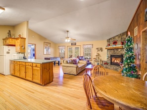 Cozy living area with a round dining table and fireplace, perfect for relaxing and socializing.