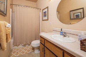 Combined shower/bathtub, hair dryer, towels, soap