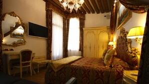 A hotel room with a bed, a desk, a chair, a television, and a wardrobe. - SPLENDID STAR SAN MARCO SQUARE - Magic Dream ! All Inclusive Options-WIFi (Venice)