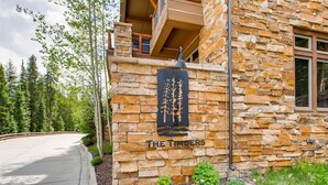 A stone building with a sign reading 'THE TIMBERS.'