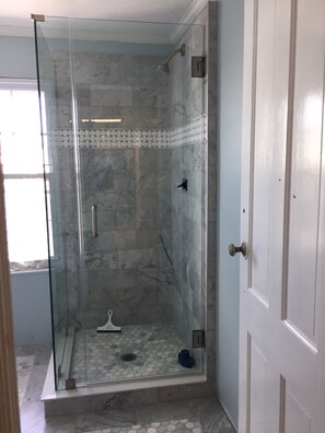 Bathtub, hair dryer, towels, soap