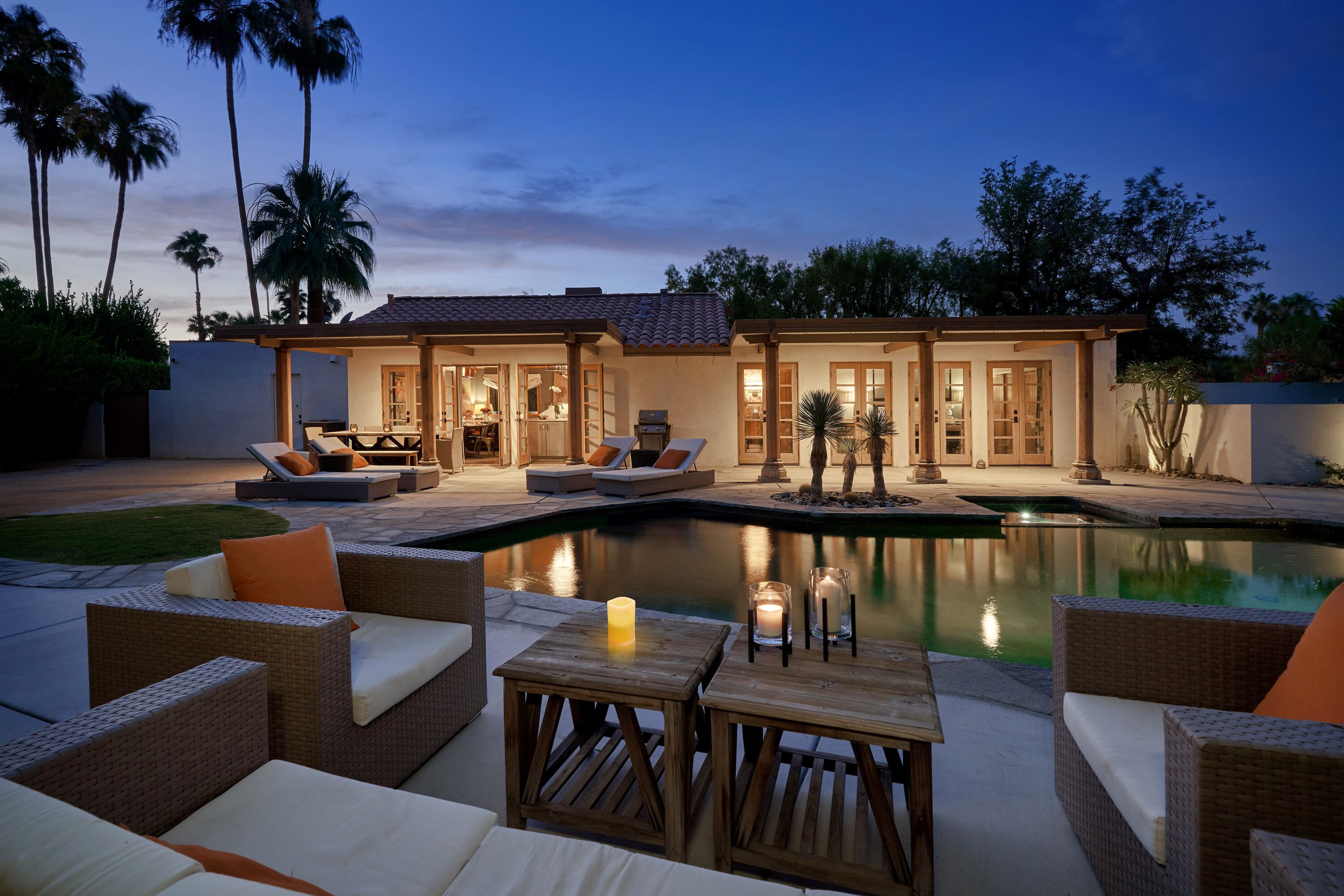 The entire south facing side of the house are French doors to the backyard oasis