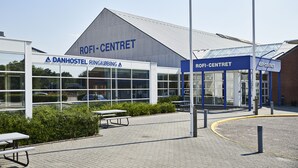 A modern building with a large glass facade and the name "ROFI-CENTRET" prominently displayed. - Danhostel Ringkøbing (Ringkobing)