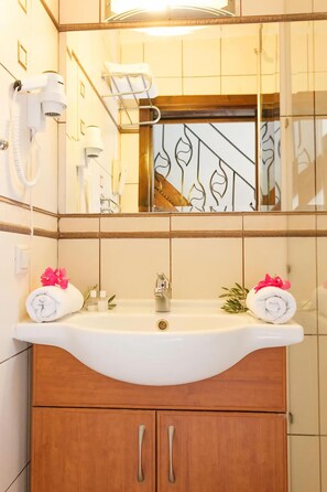 Shower, free toiletries, hair dryer, slippers