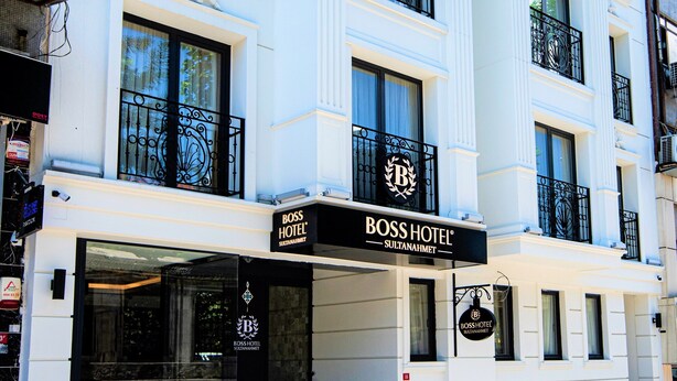 A multi-story hotel with a prominent "Boss Hotel" sign, large windows, and a classic architectural style. - Boss Hotel Sultanahmet (Istanbul)