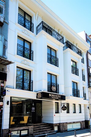A multi-story hotel with a prominent "Boss Hotel" sign, large windows, and a classic architectural style. - Boss Hotel Sultanahmet (Istanbul)
