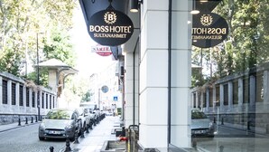 A hotel entrance with signage for Boss Hotel Sultanahmet, featuring a modern facade and a wet pavement. - Boss Hotel Sultanahmet (Istanbul)
