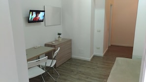 Executive Quadruple Room, Multiple Beds, Non Smoking, Ground Floor | Minibar, in-room safe, desk, blackout drapes