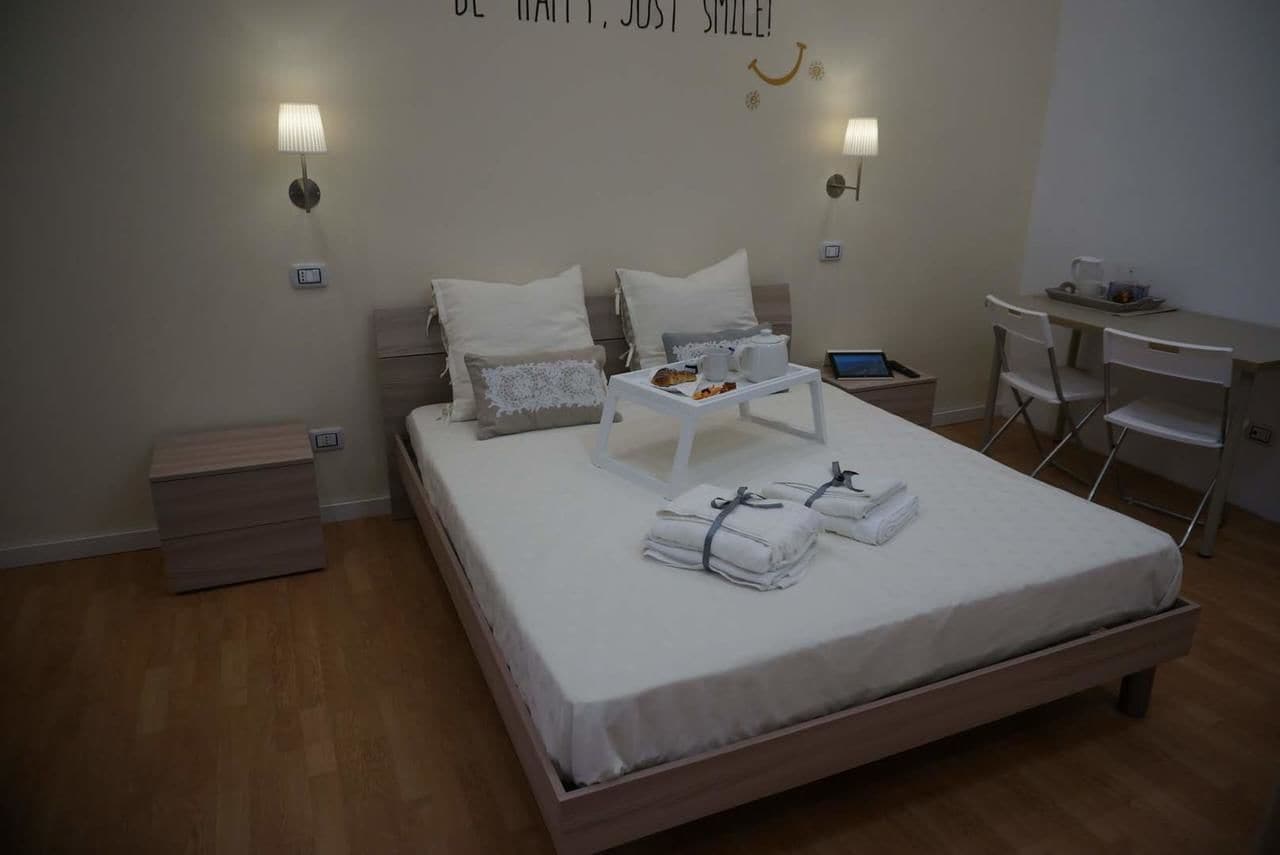 Deluxe Triple Room, Multiple Beds, Non Smoking, Ground Floor | Minibar, in-room safe, desk, blackout drapes