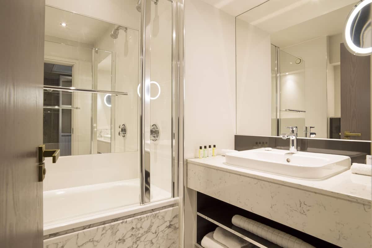 designer toiletries, hair dryer, towels, soap