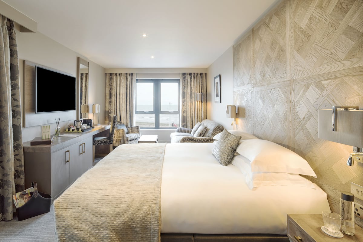 junior suite, 1 king bed, sea view | in-room safe, desk, laptop workspace, blackout curtains