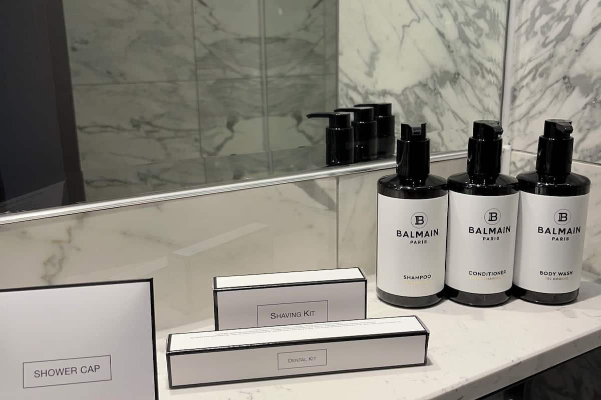 designer toiletries, hair dryer, towels, soap