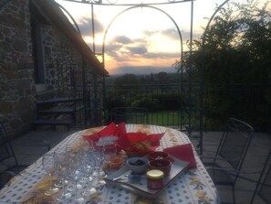 Enjoy a romantic meal al fresco with a beautifully set table and wine pairing.