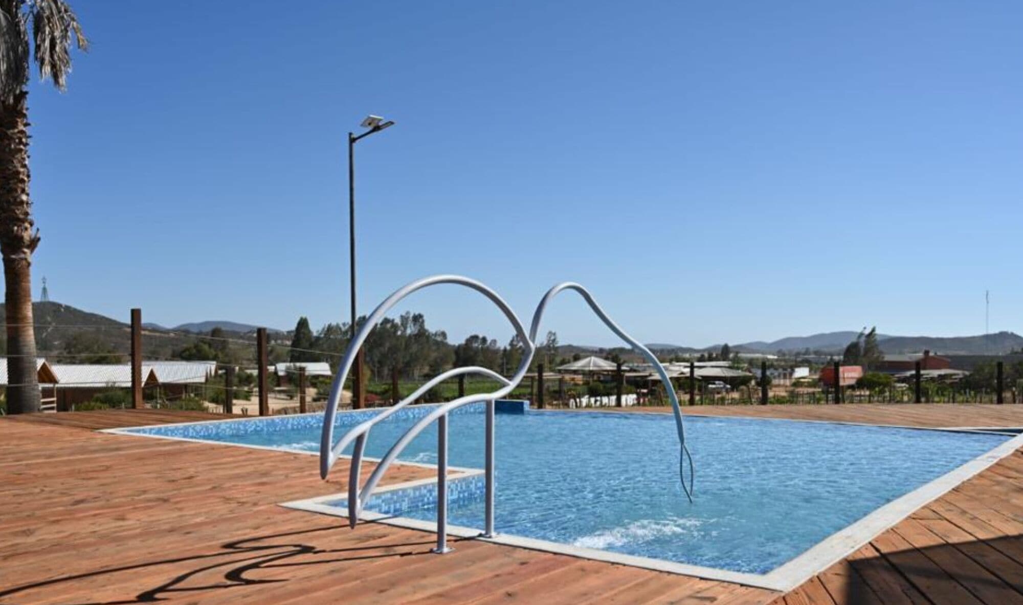 seasonal outdoor pool, open 8:00 am to 8:00 pm, pool umbrellas