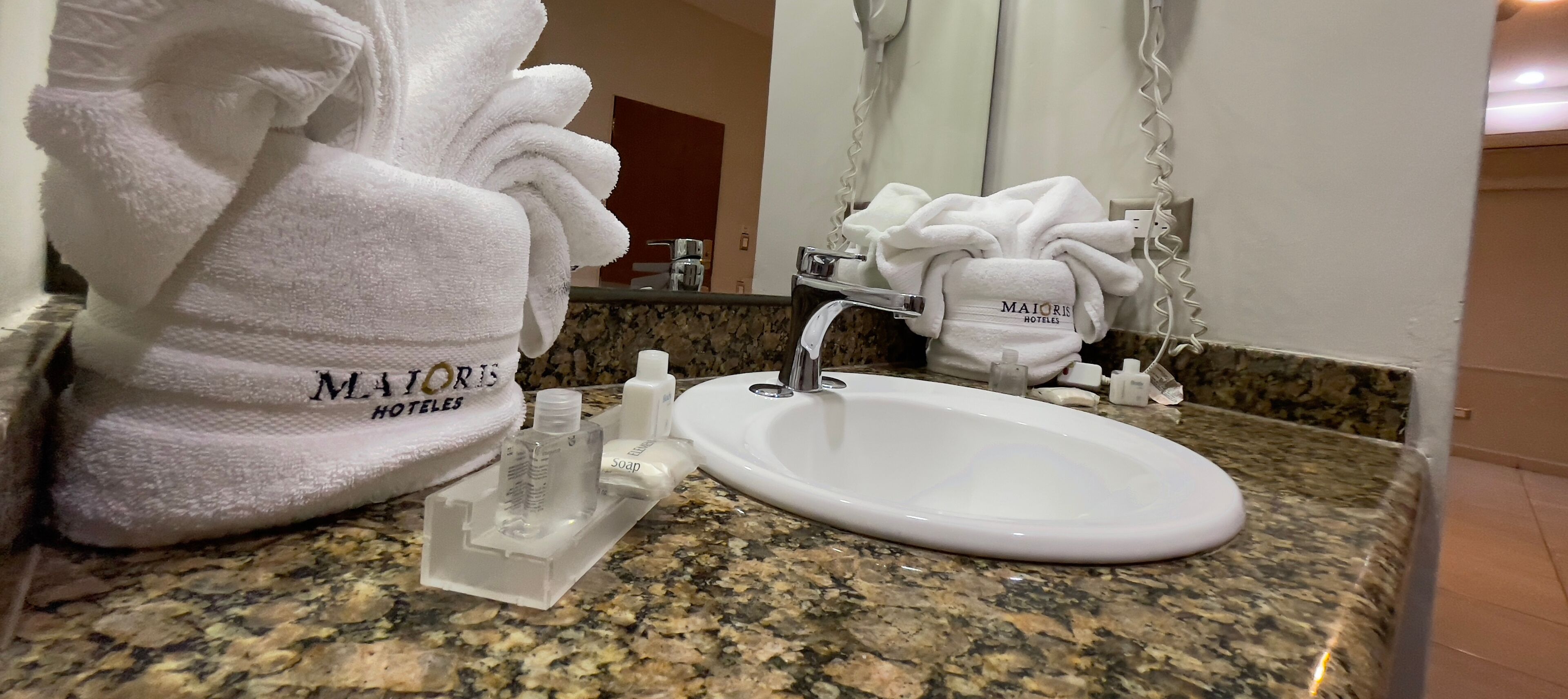 hair dryer, towels, soap, shampoo