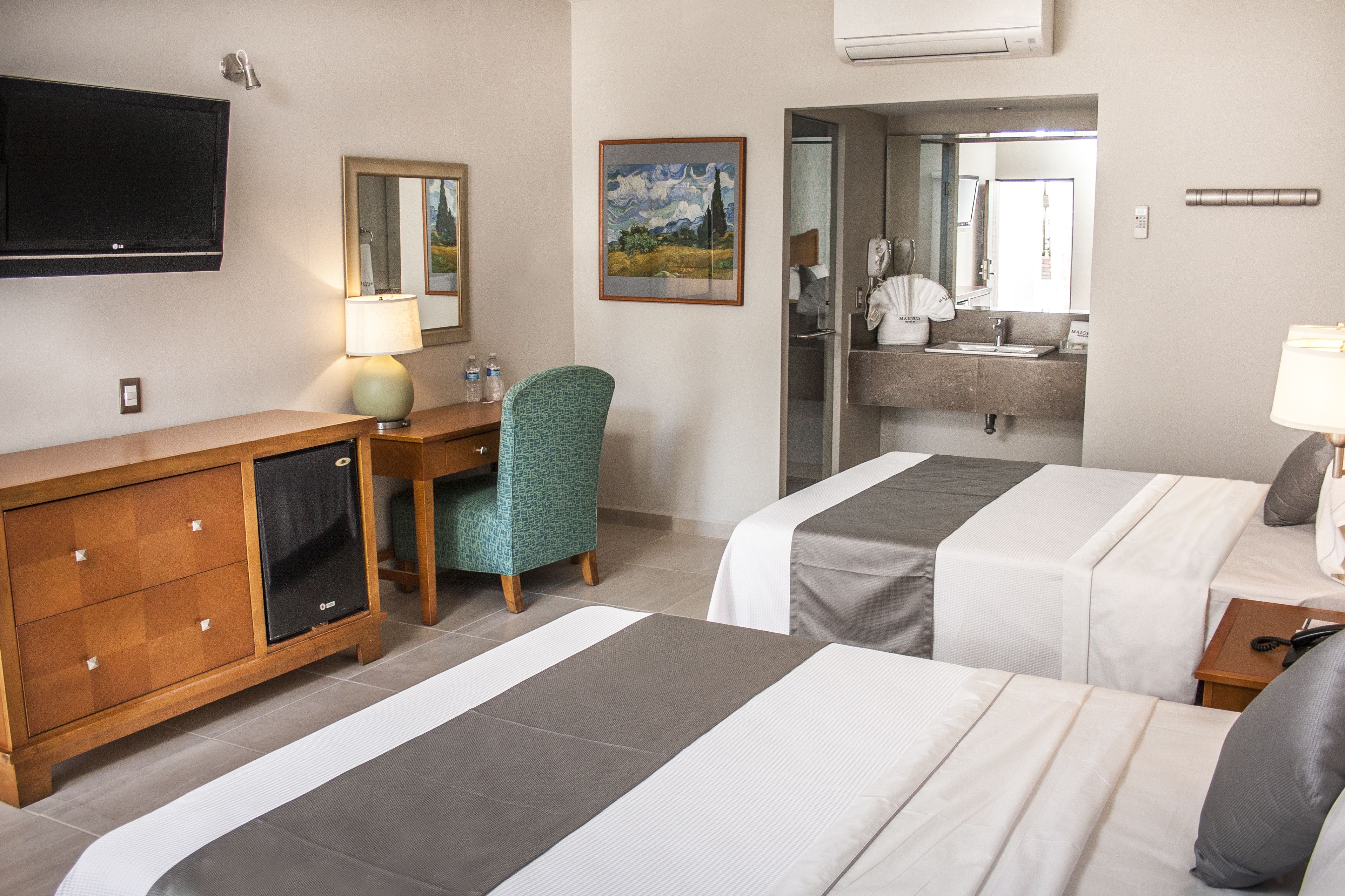 deluxe double room, 2 queen beds | bathroom | hair dryer, towels, soap, shampoo