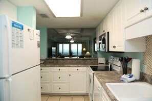 Condo, 2 Bedrooms | Private kitchen | Fridge, microwave, oven, dishwasher