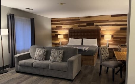 King Junior Suite - Fire Place | Desk, laptop workspace, blackout drapes, iron/ironing board. The Brewery Lodge Hotel