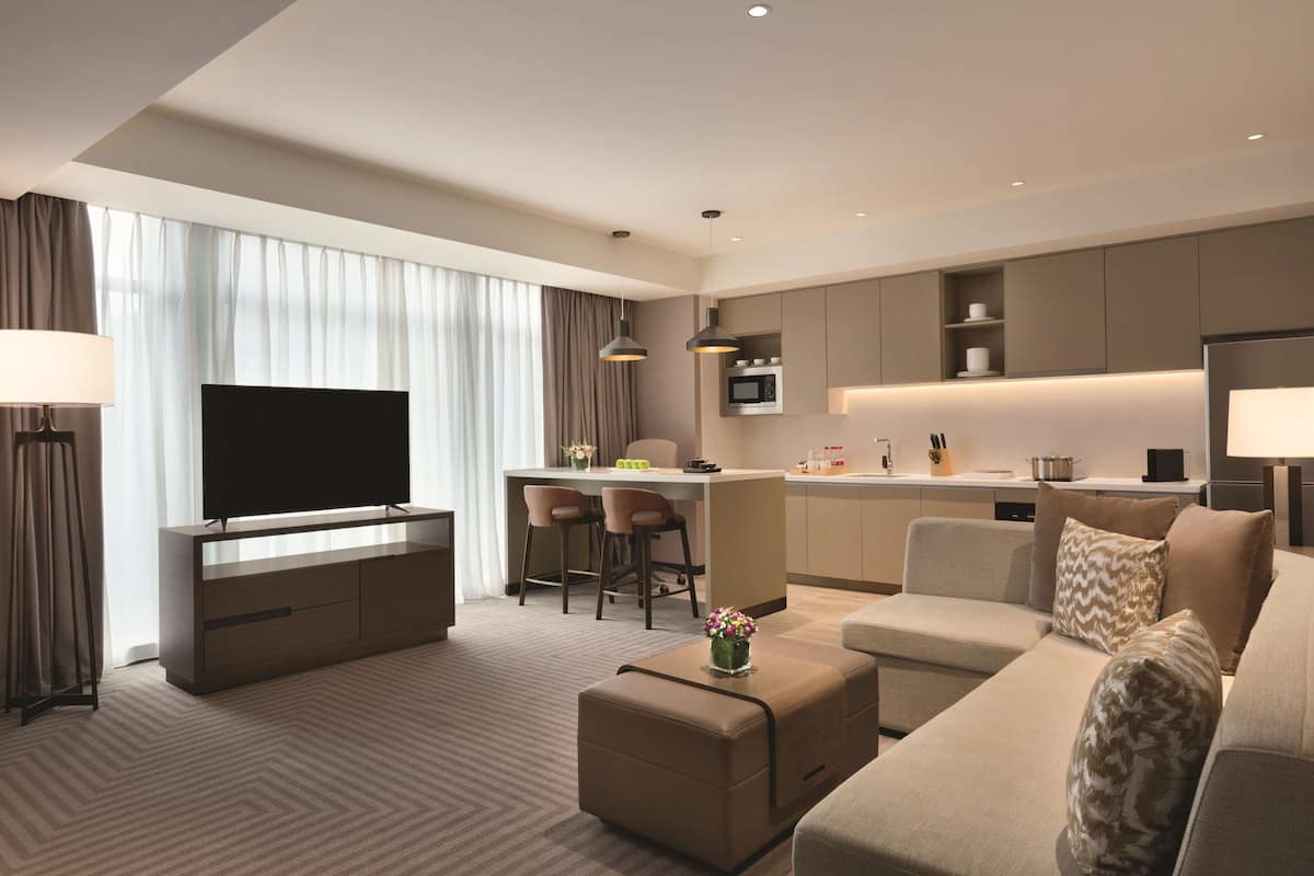 two-bedroom kitchen suite with one king bed and two twin beds - with sofa bed | private kitchenette | microwave