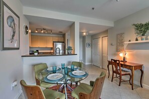 Enjoy formal dining in this stylish space with a round table and comfortable seating for four.