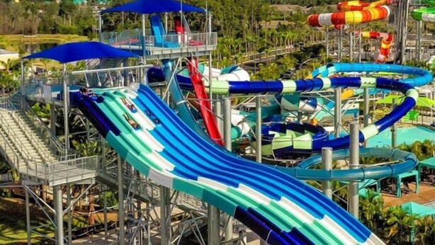 A water park with multiple slides and a pool area.