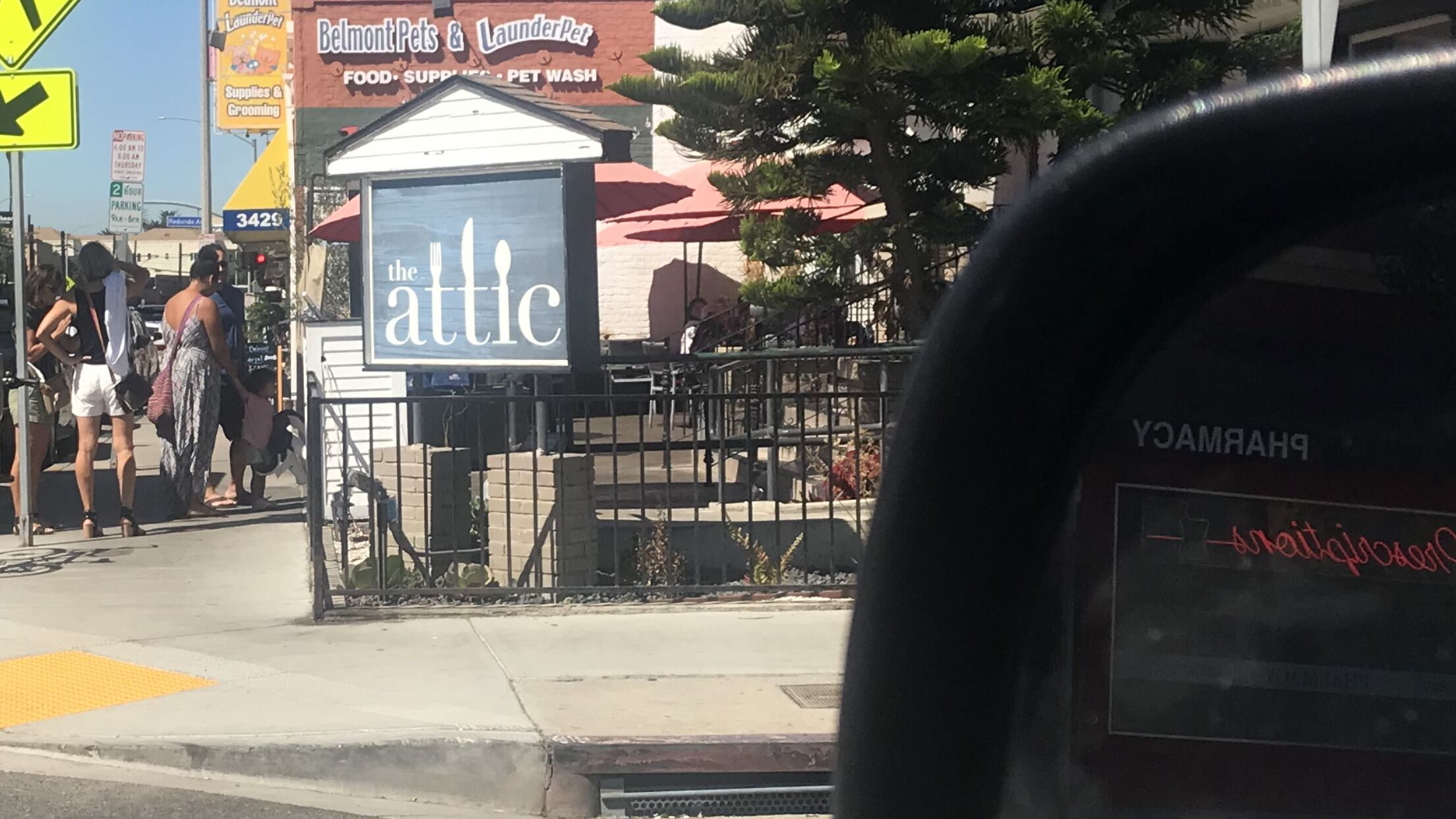 A street view with a pet grooming and food supply store named 'Belmont Pets & LaunderPet'.