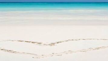 On the beach, sun loungers, beach towels