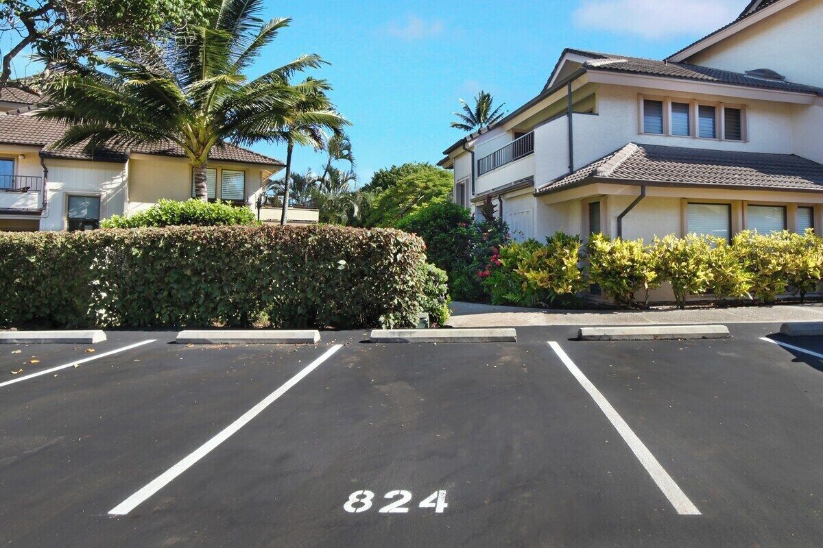 A parking lot with marked spaces and the number 824.