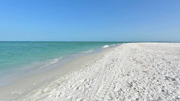 On the beach, sun loungers, beach towels