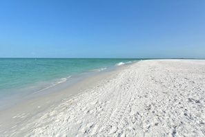 On the beach, sun loungers, beach towels