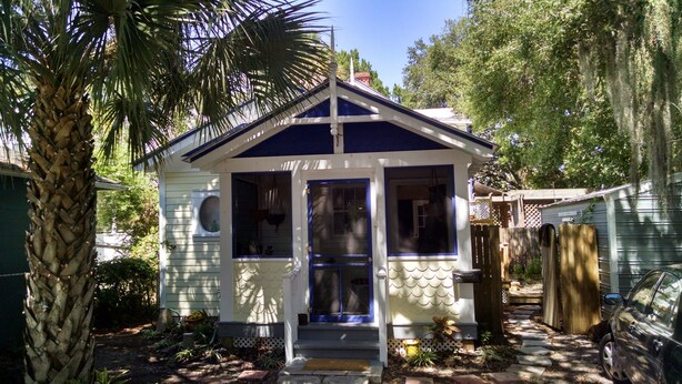 A small, single-story house with a gabled roof and a front porch. - The Rohde Guest House (St Augustine)