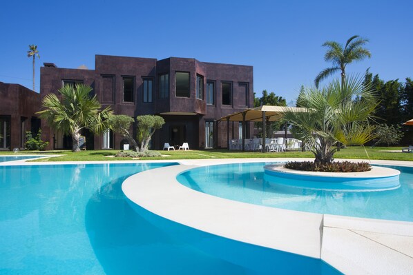 Outdoor pool, pool umbrellas, pool loungers
