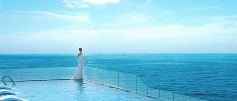 Outdoor pool, open 6 AM to 8:00 PM, sun loungers, lifeguards on site