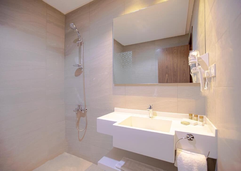 superior studio suite (jacuzzi) | bathroom | shower, free toiletries, hair dryer, slippers